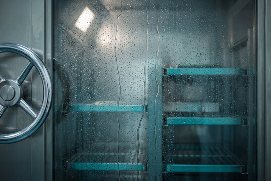 Cold Storage Refrigerator Interior with Condensation and Stainless Steel Door