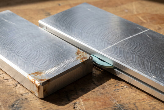 Steel Blocks with Machined Surfaces on a Workbench