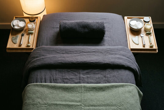 Luxury spa massage table with towels and treatment accessories