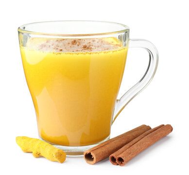 Golden milk turmeric latte in mug isolated on white