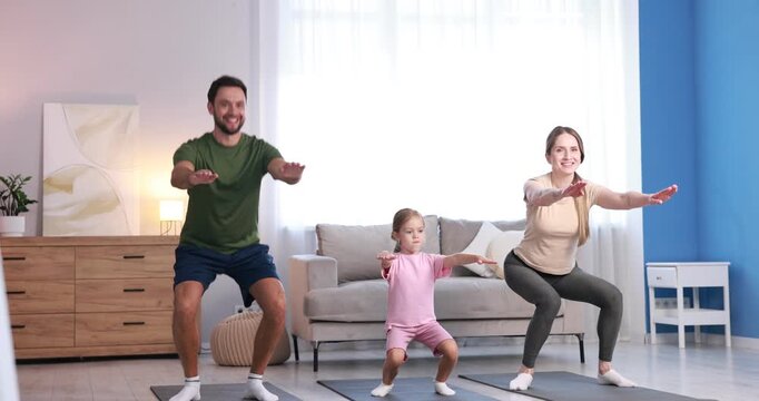 Happy family doing exercise together at home