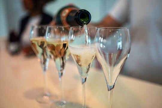 Tasting sparkling wine in Champagne cellars in Epernay, wine tour, visit cellars, Champagne, France.