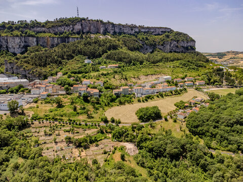 Aerial view of Roquefort-sur-Soulzon village in southern France, production of Roquefort French blue cheese made from sheep's milk, aged in natural Combalou caves