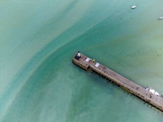 Aerial drone view of underwater oyster farms in Cancale, Brittany, covered during high tide, raditional sustainable aquaculture and production of premium French oysters, France © barmalini