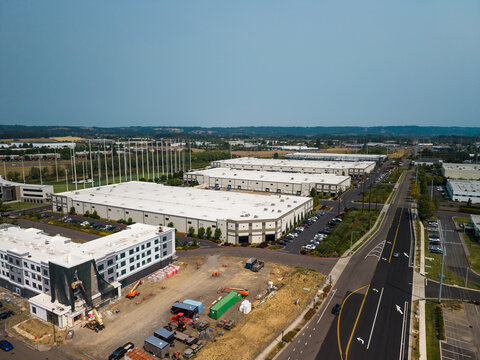 Aerial view of Hillsboro data centers featuring large industrial warehouses, parking lots, and surrounding infrastructure in Hillsboro, Oregon, United States.