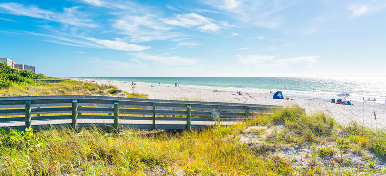 Wooden Boardwalk to Indian rocks beach in Florida, USA