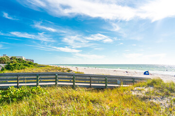 Wooden Boardwalk to Indian rocks beach in Florida, USA © Maria