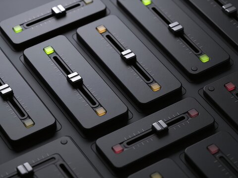 A top-down view of an audio mixing console with faders and buttons, set in a professional studio environment. The