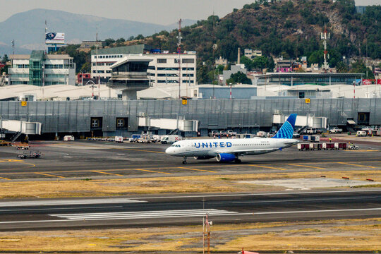 Benito Juarez International Airport, Mexico City, Mexico - January 24, 2024 - United Airlines Airbus A320 taxis past the terminal at Mexico City International Airport (MEX)