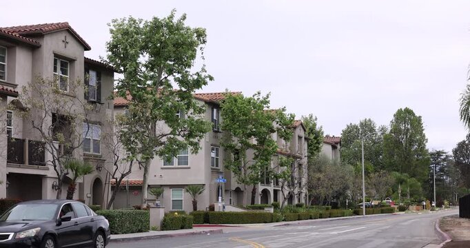 Overcast stormy sky over apartment homes in Montebello, California, USA.