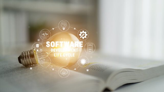 Illuminated Bulb Symbolizing Software Development Life Cycle with Icons Representing Stages of Programming and Project Management on Open Book Background Quark.