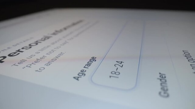 Motorized moving shot of completing demographic information form on tablet