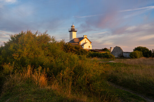 Pontusval lighthouse at sunrise, coastal France, travel concept, landmark. Copy space banner