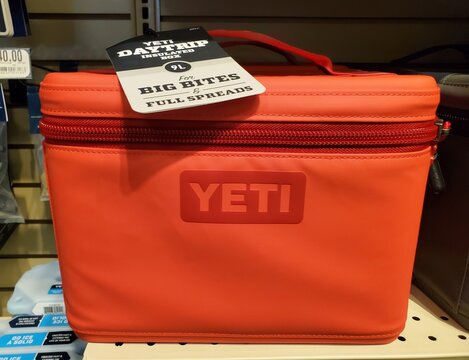 Atlantic City, New Jersey, U.S.A - Aug 17, 2026 - Bright red YETI Daytrip insulated box 9L with red zipper and handle designed for carrying larger food portions.
