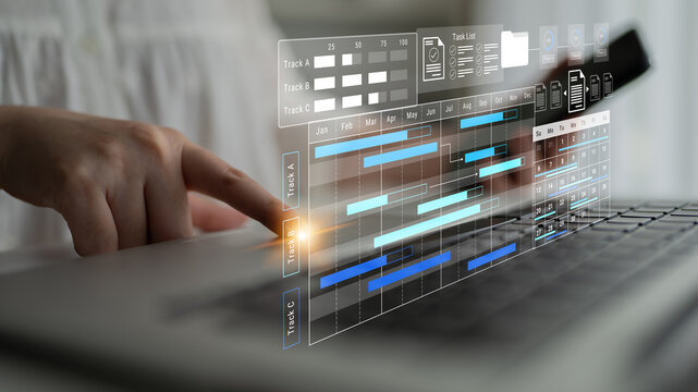 A close-up of a hand interacting with a laptop, showcasing a digital interface for task management and project scheduling, emphasizing efficiency and organization in modern workflows. Gantry