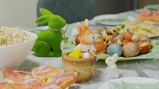Colorful Easter feast combines dyed eggs, rosol salad, salmon bites, bunny decor
