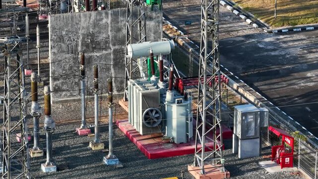 Industrial electrical power substation distributing electricity through high voltage towers