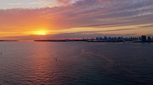 Sunset cloudy sky. Seascape at summer vacation. Skyscape with sea horizon. Horizon sunrise sea with ship. Sunrise seascape. Romantic summer vacation Florida seascape. Sea sunset horizon