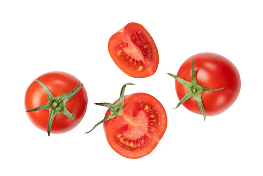 Tomatoes placed on a white background and cut tomatoes