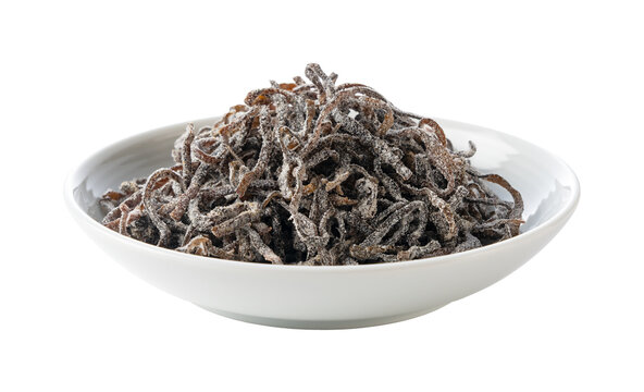 Shio kombu salted dried kelp in a white dish isolated on transparent background, Japanese food ingredient cutout PNG