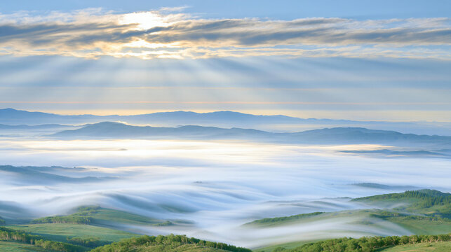Expansive Landscape with Rolling Hills and Fog Under Sunlight at Dawn in a Peaceful Atmosphere