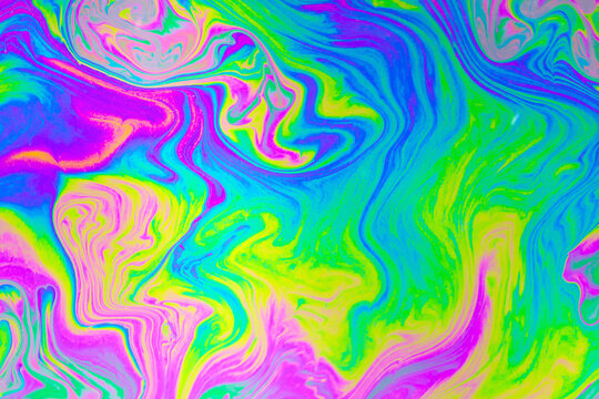 Abstract liquid color swirl background with vibrant neon paint texture and fluid motion