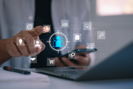 Target customer, customer-centric strategies. Businessman using laptop, smartphone. Customer targeting enhances marketing strategy, optimizes performance, supports business development and engagement.