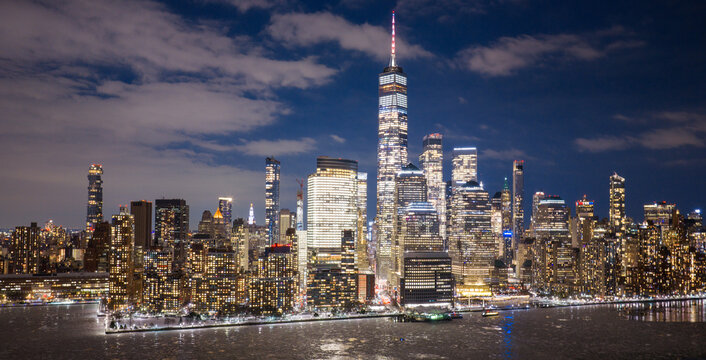 NYC Manhattan skyline at night. New York City iconic panorama. New York downtown towers. Manhattan night skyline.