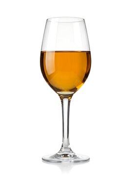 A stemware wine glass filled with an ambercolored liquid, like white wine or sherry, isolated on white background