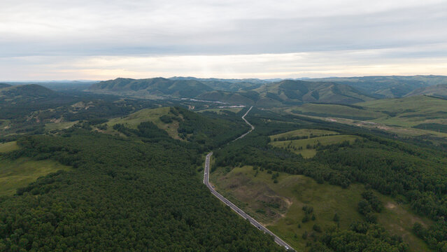 Aerial panoramic view of Huanggangliang National Forest Park in Chifeng, Inner Mongolia. Vast forest mountain natural landscape, dense woods, mountainous terrain and magnificent northern forest scener