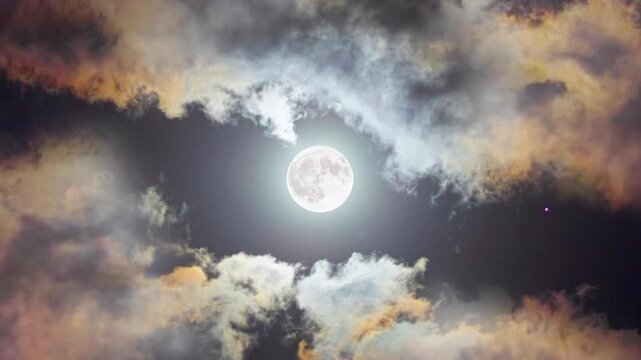 A full moon shining brightly in the night sky. Its radiance casts a natural halo, encircled by dramatic, slowly moving clouds that shimmer with iridescent colors.