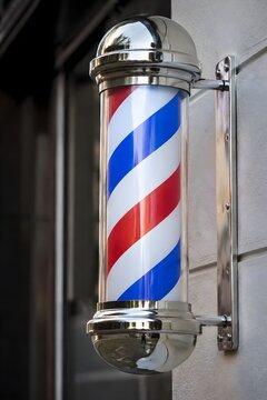 Classic Barber Pole Spiral Detail Stands Against a Simple Exterior Wall with Glossy Finish Photography