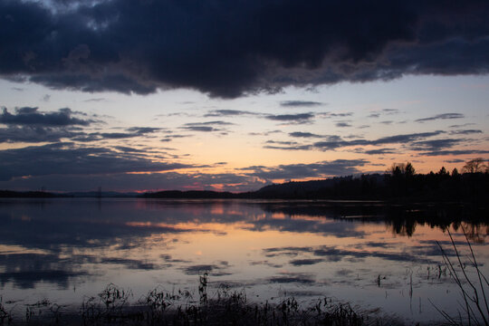 Dramatic Sunset Clouds Reflecting on River
