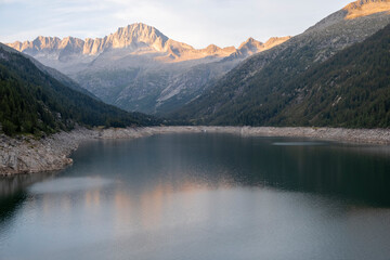 Fototapeta premium Alpine Lake Mirror Reflection Dusk Alpenglow Val di Fumo Trentino Italy