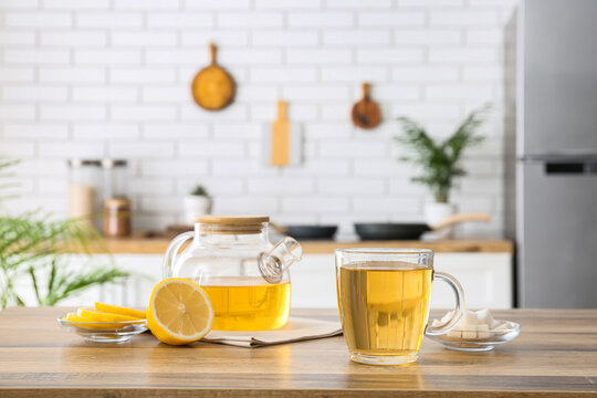 Healthy lifestyle and wellness concept, herbal tea with lemon and sugar on a kitchen counter, natural drink for relaxation