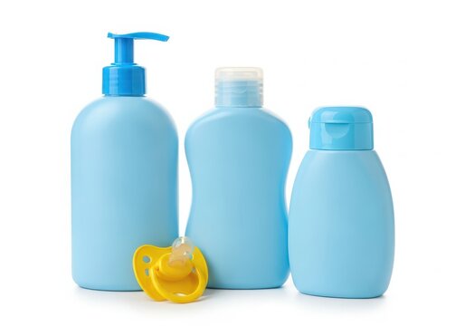Light blue baby soap bottles and pacifier set isolated on white background