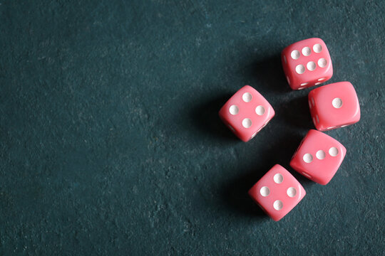 Pink dices on color background