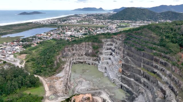 Quarry in Rio Tavares Near Campeche Urban Area in Florian&oacute;polis, Santa Catarina, Brazil. Aerial View. Establishing Shot.