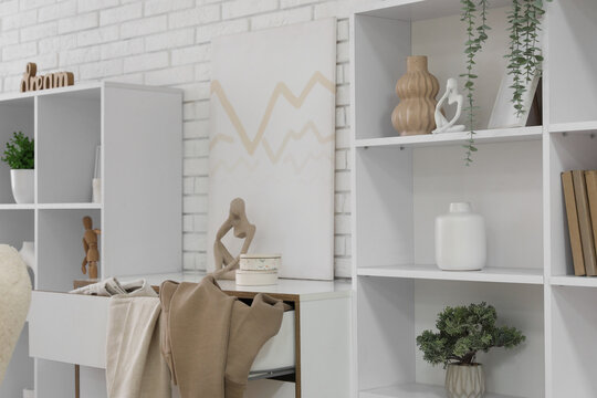 Interior of dressing room with commode and shelf units