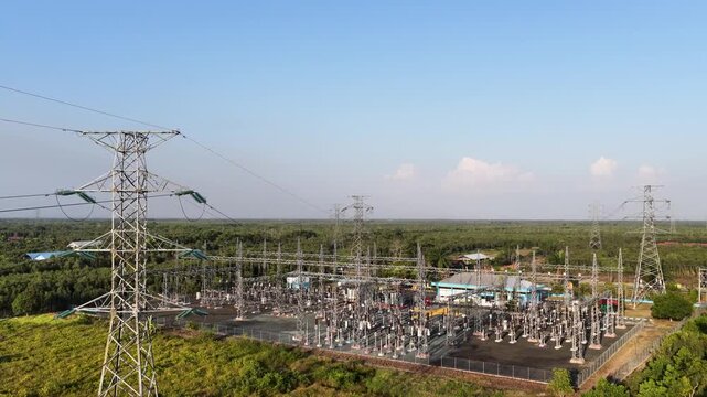 Metal towers distribute electricity at a South Kalimantan power station