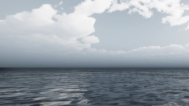 The ocean stretches far into the distance, reflecting the clouds above. The sky is filled with a mix of gray clouds. The water appears still and calm as dusk approaches.