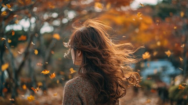 Happy Young woman,playing and lying on green grass,falling maple leaves,Colorful autumn Park,red and yellow maple trees,blue sky,forest path,Lawn in city park,yellow leaves in park,Natural Wallpaper.