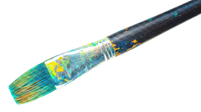 Used paintbrush with colorful dried paint splatters