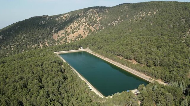 Cinematic drone footage showcasing the lush green landscape surrounding Prodromos Dam.