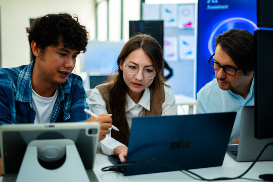 software developer talk strategy plan to executive write prompt AI bot IT app program data analytics in tech startup office.Projected visuals and glowing code on screen.AI chatbot technology concept