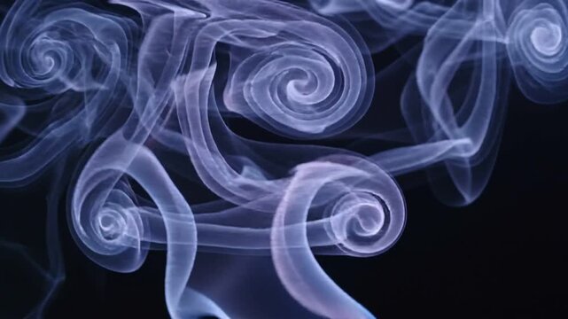 Blue smoke swirls rising on black background