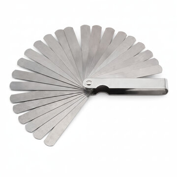 Generic precision tempered spring steel feeler gauge gap clearance blade set isolated on white.