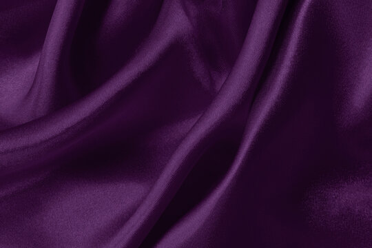 Purple fabric cloth texture for background and design art work, beautiful crumpled pattern of silk or linen.