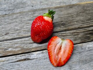Natural strawberry cut in two halves with leaves © nicolas