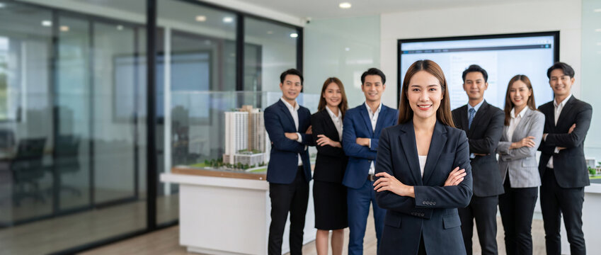 Commercial real estate consultant leads diverse property team in modern office, highlighting leasing, property investment, client advisory, market expertise and professional real estate services.